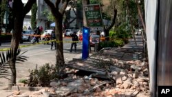 A damaged abandoned home is seen in the Juarez neighborhood after a strong earthquake jolted Mexico City, April 18, 2014. 