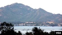 FILE - Vietnam Navy ships barely visible inside Cam Ranh Bay (D. Schearf/VOA).