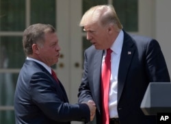 President Donald Trump and Jordan's King Abdullah II shake hands following a news conference in the Rose Garden of the White House in Washington, April 5, 2017.