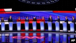 FILE - Candidates participate in the July 30, 2019, Democratic presidential debate.