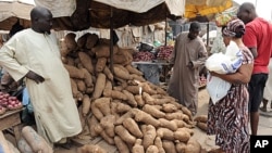 A woman shops for yams at Mile 12 market in Lagos, January 14, 2012.