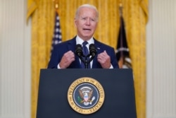 President Joe Biden speaks about the suicide attack at Kabul airport, at the East Room of the White House, in Washington, Aug. 26, 2021.
