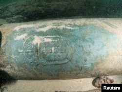 One of the nine nine bronze cannons engraved with the Portuguese coat of arms found by divers around a shipwreck near Cascais, Portugal, Sept. 24, 2018.