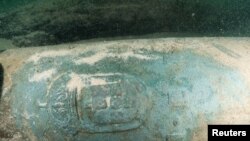 One of the nine nine bronze cannons engraved with the Portuguese coat of arms found by divers around a shipwreck near Cascais, Portugal, Sept. 24, 2018.