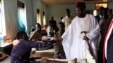 FILE - South Sudan's President Salva Kiir greets Sudan People's Liberation Army soldiers receiving treatment at the Juba Military hospital in the capital Juba, Dec. 26, 2016. 