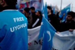 Demonstrators take part in a protest outside the Chinese embassy in Berlin on Dec. 27, 2019, to call attention to China’s mistreatment of members of the Uyghur community in western China.