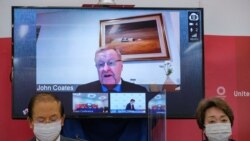 CEO of the Tokyo 2020 Toshiro Muto (L) and President of the Tokyo 2020 Seiko Hashimoto (R) listen to International Olympic Committee vice president John Coates (on screen) delivering a speech during a press conference in Tokyo, Japan, May 21, 2021.