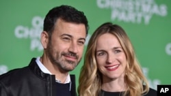 FILE - Jimmy Kimmel, left, and Molly McNearney arrive at the Los Angeles premiere of "Office Christmas Party" at the Village Theatre Westwood, Dec. 7, 2016. 