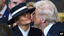 President-elect Donald Trump kisses Melania Trump before the 60th Presidential Inauguration in the Rotunda of the U.S. Capitol in Washington, Jan. 20, 2025. 