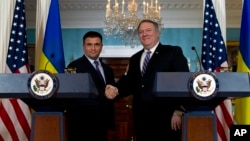 Secretary of State Mike Pompeo shake hands with Ukrainian Foreign Minister Pavlo Klimkin after speaking to the media at the Department of State, Nov. 16, 2018, in Washington.