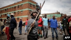 Zulu protesters demonstrate against foreign migrants outside their hostel in the Jeppestown district of Johannesburg, South Africa, April 17, 2015.