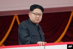 FILE - North Korea's leader Kim Jong Un watches a parade from a balcony at the Kim Il Sung Square in Pyongyang.
