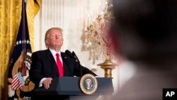 FILE - President Donald Trump takes a question during a news conference in the East Room of the White House in Washington, Feb. 16, 2017.