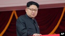 FILE - North Korea's leader Kim Jong Un watches a parade from a balcony at the Kim Il Sung Square in Pyongyang.