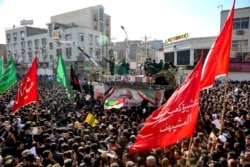 Flag draped coffins of Gen. Qassem Soleimani and his comrades are carried on a truck during their funeral in southwestern city of Ahvaz, Iran, Jan. 5, 2020. (photo provided by the Iranian Students News Agency, ISNA)