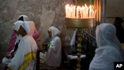 Ethiopian Christians pray at Deir El Sultan outside the Church of the Holy Sepulchre, traditionally believed by many to be the site of the crucifixion of Jesus Christ, during the Holy Week procession in Jerusalem's Old City, April 20, 2019. 