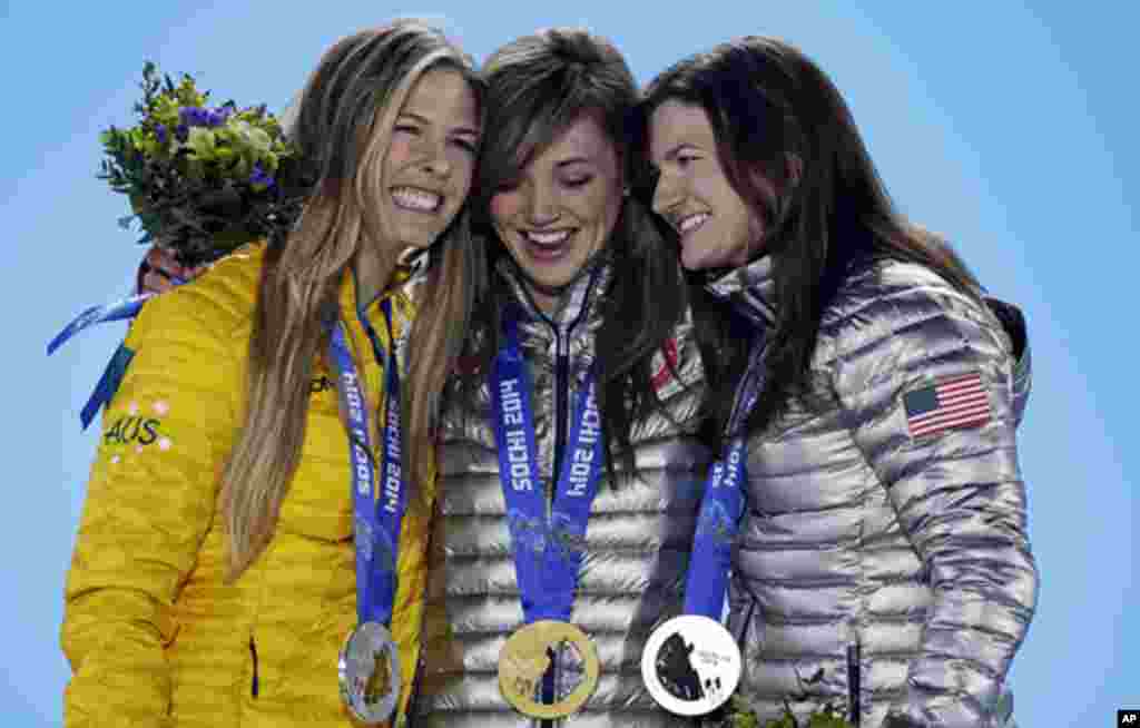 Women's snowboard halfpipe medalists, from left, Torah Bright of Australia, silver, Kaitlyn Farrington of the United States, gold, and Kelly Clark of the United States, bronze, pose with their medals at the 2014 Winter Olympics in Sochi, Feb. 13, 2014. 