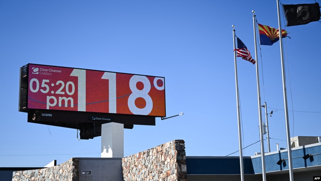 FILE - A billboard displays a temperature of 118 degrees Fahrenheit (48 degrees Celcius) during a record heat wave in Phoenix, Arizona, on July 18, 2023.