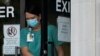 An individual wearing a face mask exits the Ouachita Parish Courthouse in Monroe, La., Aug. 5, 2021.