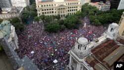 People protest against leading presidential candidate Jair Bolsonaro, long known for offensive comments about gays, women and black people, at Cinelandia Square in Rio de Janeiro, Brazil, Sept. 29, 2018.