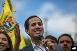 FILE - Venezuela's Juan Guaido speaks to supporters in a public plaza in Las Mercedes neighborhood of Caracas, Venezuela, Jan. 26, 2019.