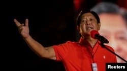 File - Named after his Philippine dictator father, Ferdinand Marcos Jr. campaigns for president. With more than 90 percent of ballots counted, he is the presumed winner in the May 2022 election.