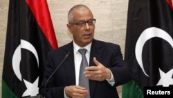 L'ancien premier ministre Ali Zeidan parle à une conférence de Tripoli, le 8 mars 2014. 