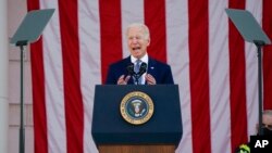 President Joe Biden speaks during an event to commemorate Veterans Day at Arlington National Cemetery, in Arlington, Va., Nov. 11, 2021.