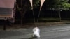 This handout photo taken by the South Korean Defense Ministry between the night of May 28 and 29, 2024, and released on May 29 shows unidentified objects believed to be North Korean propaganda material attached to balloons on a street in Chungnam.