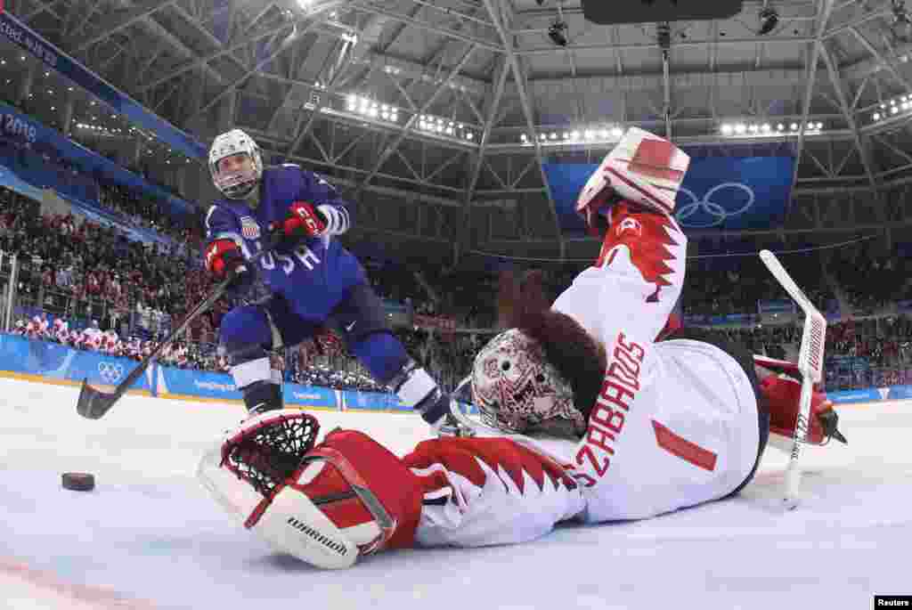 Jocelyne Lamoureux-Davidson of the U.S. scores the game winning goal against goalkeeper Shannon Szabados of Canada during a shootout in the women's gold medal hockey game in Gangneung, South Korea, Feb. 22, 2018.