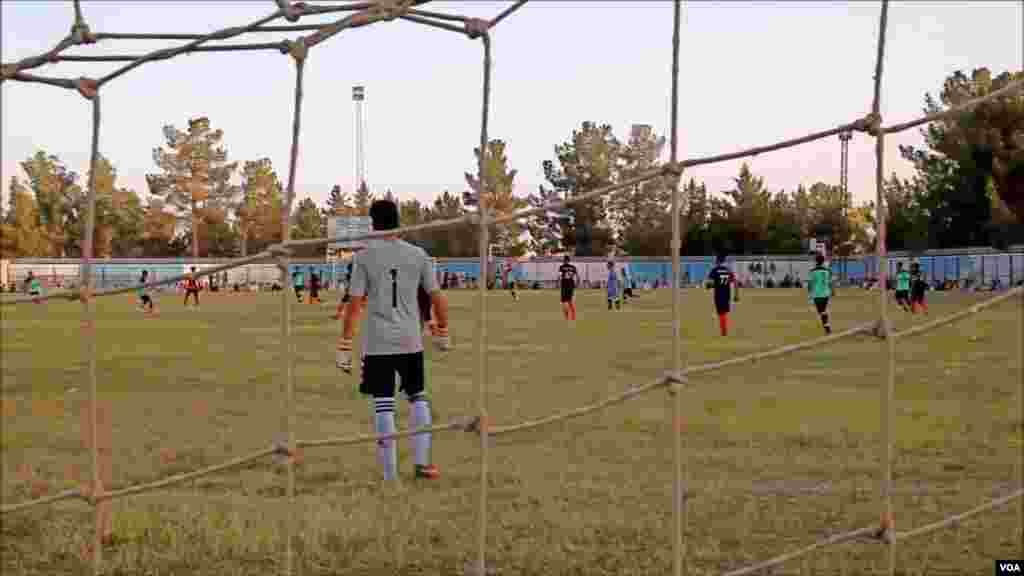 A child looks through the windshield of a car during a heavy rain shower in Chennai, India.