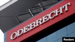 File - A sign of the Odebrecht SA construction conglomerate is pictured in Lima, Peru, June 28, 2016.