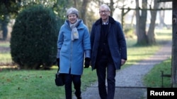 Britain's Prime Minister Theresa May and her husband Philip leave church, near High Wycombe, Britain, Feb. 17, 2019.