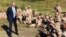 FILE - Defense Secretary Jim Mattis talks to U.S. Marines at a rifle range at Guantanamo Bay, Cuba, Dec. 21. 2017. The unannounced visit was the first by a defense secretary since Donald Rumsfeld visited in January 2002 shortly after the first prisoners arrived from Afghanistan. 