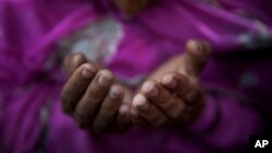 A Muslim woman prays at the shrine of Sufi saint Khwaja Moinuddin Chishti during the Urs festival in Ajmer, in the western Indian state of Rajasthan, India, Friday, April 24, 2015.