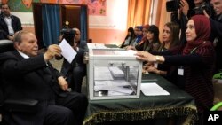 FILE - Algerian President Abdelaziz Bouteflika casts his election ballot in Algiers, May 4, 2017.