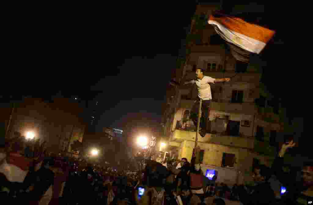 Egyptians celebrate after President Hosni Mubarak resigned and handed power to the military, Feb. 11, 2011.