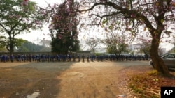 FILE: Schoolchildren queue outside their school in Harare, Zimbabwe, Monday, Sept, 28, 2020. 