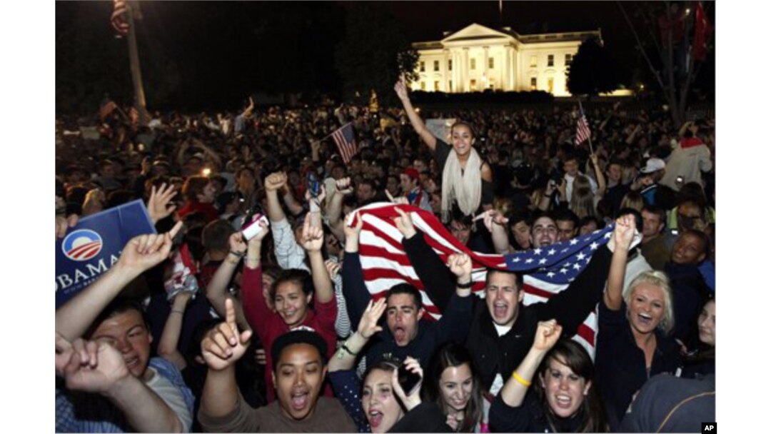 Crowds celebrate outside the White House in Washington early Monday following President Obama's televised announcement.