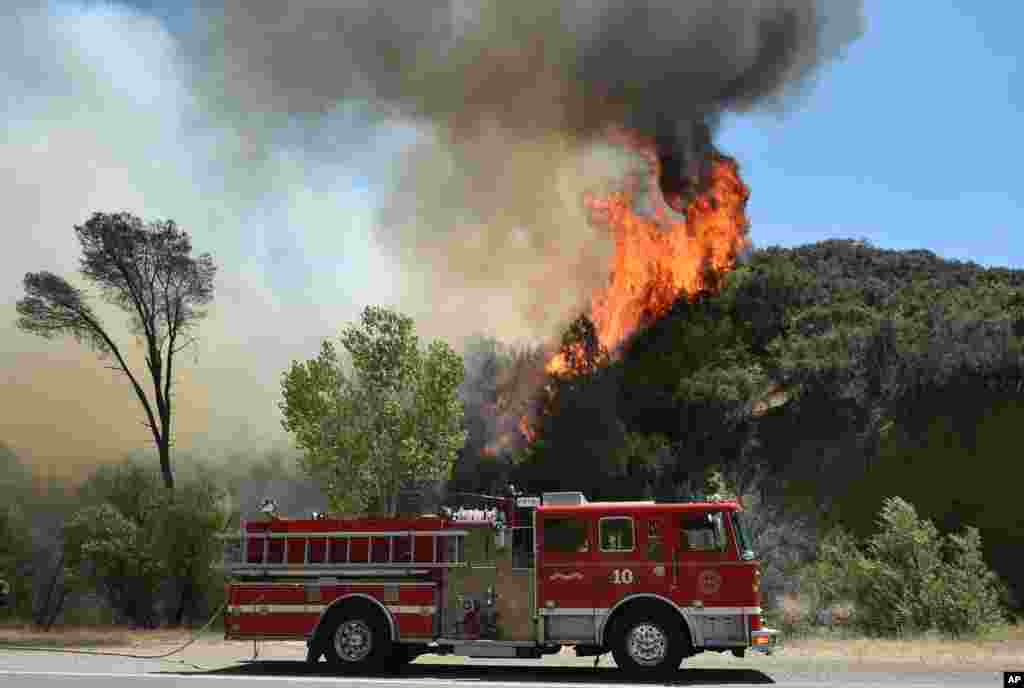 Flames rise from a wildfire near Clearlake, Calif., Aug. 3, 2015. Officials called for evacuations as numerous homes were threatened by the flames.
