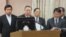 台湾国防部长严明(左二)等相关官员在立法院接受质询（美国之音张永泰拍摄） 