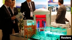 FILE - A nuclear power plant station model by China National Nuclear Corporation is pictured at the World Nuclear Exhibition 2014, the trade fair event for the global nuclear energy sector, in Le Bourget, near Paris, October 14, 2014. 