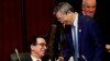 China's Central Bank Governor Yi Gang shakes hands with U.S. Treasury Secretary Steve Mnuchin, left, during the G20 Finance Ministers and Central Bank Governors Meeting Saturday, June 8, 2019, In Fukuoka, Japan.