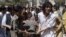 Pakistani Shi'ite Muslims carry the body of a person killed by gunmen at a local hospital in Quetta, Pakistan, September 1, 2012. 