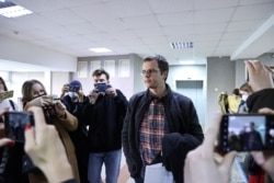 Doctor Artyom Sorokin leaves after a court hearing in Minsk, Belarus, March 2, 2021. (Sergei Sheleg/BelTA/Handout via Reuters)