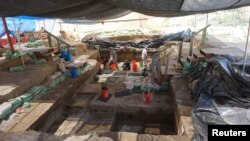 Excavation work by scientists at the Cooper's Ferry archaeological site located along the Salmon River in western Idaho is shown in this image released August 29, 2019. (Loren Davis/Oregon State University/Handout via REUTERS) 