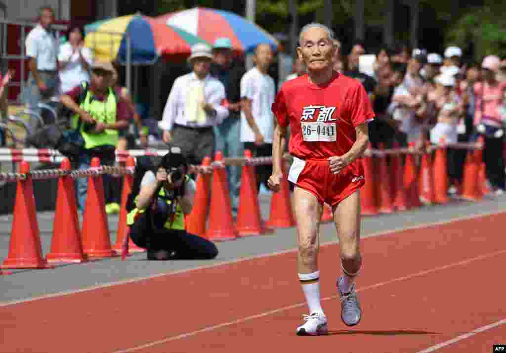 Hidekichi Miyazaki, 105, runs with other competitors over eighty years of age during a 100-meter-dash in the Kyoto Masters Autumn Competiton in Kyoto, western Japan. Miyazaki was authorized as the oldest sprinter who competed in a 100-meter-dash by the Guinness World Records.&nbsp;