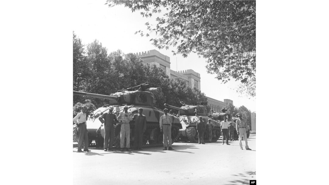 Iranian army troops and tanks stand in front of Central Police headquarters after the attempted coup d'etat against Iranian Premier Mohammad Mossadeq in Tehran, Iran, Aug. 16, 1953.