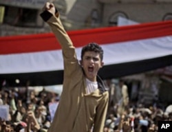 An anti-government protester shouts slogans along with other demonstrators during a demonstration demanding the resignation of Yemeni President Ali Abdullah Saleh, in Sanaa, February 26, 2011