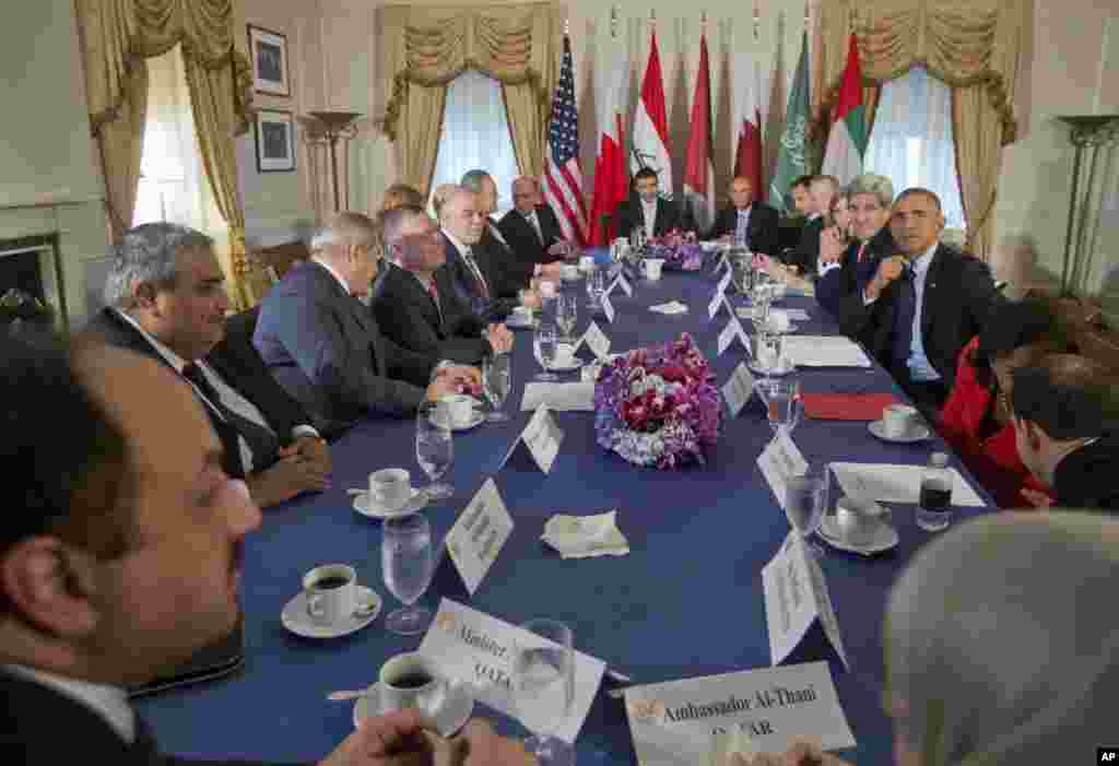 President Barack Obama, Secretary of State John Kerry, and other officials, meet with the representatives of the five Arab nations who partipated in strikes against the Islamic State targets in Syria, in New York, Tuesday, Sept. 23, 2014. 